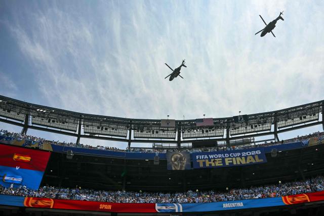 Marine One, carrying US President Donald Trump, flies over the stadium ahead of the 2026 World Cup football tournament final match between Spain and Argentina at the New York/New Jersey Stadium in East Rutherford on July 19, 2026.  (Photo by Mandel NGAN / AFP)