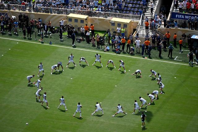 Argentina's players warm-up ahead of the 2026 World Cup football tournament final match between Spain and Argentina at the New York/New Jersey Stadium in East Rutherford on July 19, 2026.  (Photo by Jewel SAMAD / AFP)