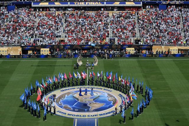 (Center) US singer Nicole Scherzinger, British singer-Songwriter Robbie Williams and Italian singer Laura Pausini perform the FIFA anthem 'Desire' during the closing ceremony of the 2026 World Cup football tournament final match between Spain and Argentina at the New York/New Jersey Stadium in East Rutherford on July 19, 2026.  (Photo by ANGELA WEISS / AFP)