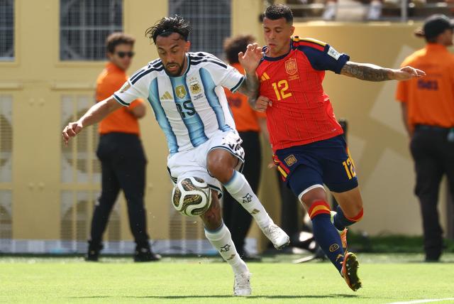 Argentina's forward #15 Nicolas Gonzalez (L) and Spain's defender #12 Pedro Porro fight for the ball during the 2026 World Cup football tournament final match between Spain and Argentina at the New York/New Jersey Stadium in East Rutherford on July 19, 2026.  (Photo by CHARLY TRIBALLEAU / AFP)