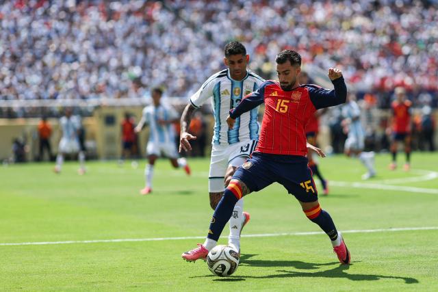 Spain's midfielder #15 Alex Baena and Argentina's defender #13 Cristian Romero fight for the ball during the 2026 World Cup football tournament final match between Spain and Argentina at the New York/New Jersey Stadium in East Rutherford on July 19, 2026.  (Photo by PATRICIA DE MELO MOREIRA / AFP)