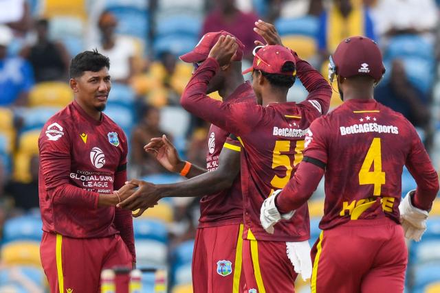 Gudakesh Motie (L) of West Indies celebrates the dismissal of Tom Latham of New Zealand during the 4th One-Day International (ODI) cricket match between West Indies and New Zealand at Kensington Oval in Bridgetown, Barbados on July 19, 2026. (Photo by Randy Brooks / AFP)
