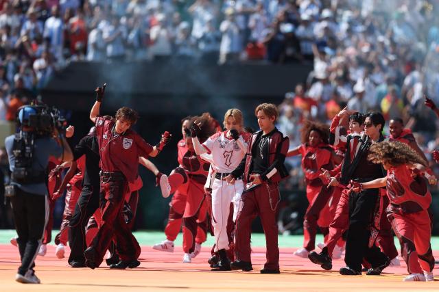 South Korean boy band BTS perform during the halftime show of the 2026 World Cup football tournament final match between Spain and Argentina at the New York/New Jersey Stadium in East Rutherford on July 19, 2026.  (Photo by PATRICIA DE MELO MOREIRA / AFP)