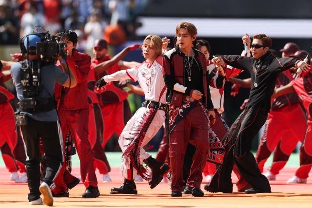 South Korean boy band BTS perform during the halftime show of the 2026 World Cup football tournament final match between Spain and Argentina at the New York/New Jersey Stadium in East Rutherford on July 19, 2026.  (Photo by PATRICIA DE MELO MOREIRA / AFP)