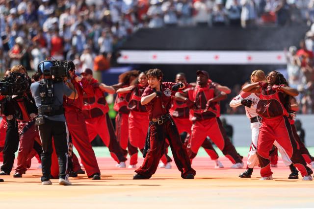 South Korean boy band BTS perform during the halftime show of the 2026 World Cup football tournament final match between Spain and Argentina at the New York/New Jersey Stadium in East Rutherford on July 19, 2026.  (Photo by PATRICIA DE MELO MOREIRA / AFP)
