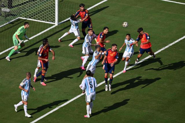 Spain's defender #22 Pau Cubarsi (R) heads the ball during the 2026 World Cup football tournament final match between Spain and Argentina at the New York/New Jersey Stadium in East Rutherford on July 19, 2026.  (Photo by ANGELA WEISS / AFP)