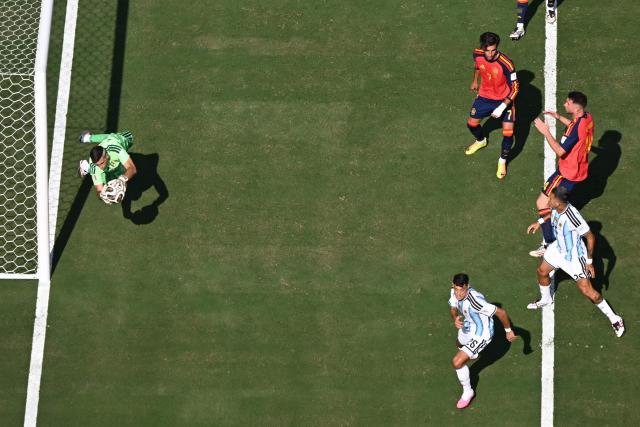 Argentina's goalkeeper #23 Emiliano Martinez makes a save during the 2026 World Cup football tournament final match between Spain and Argentina at the New York/New Jersey Stadium in East Rutherford on July 19, 2026.  (Photo by MAURO PIMENTEL / AFP)