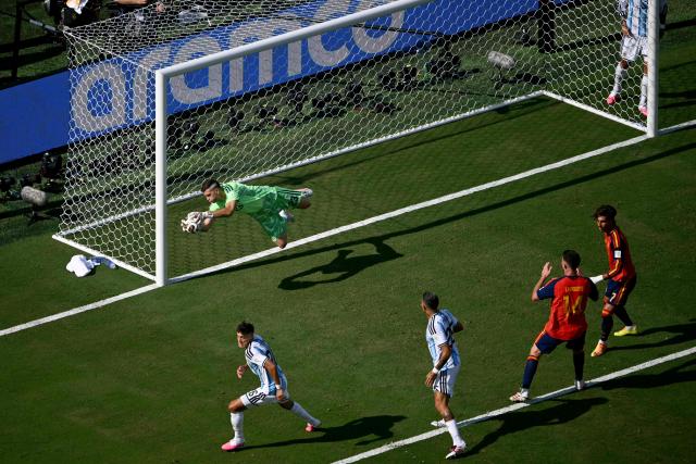 Argentina's goalkeeper #23 Emiliano Martinez makes a save during the 2026 World Cup football tournament final match between Spain and Argentina at the New York/New Jersey Stadium in East Rutherford on July 19, 2026.  (Photo by MAURO PIMENTEL / AFP)