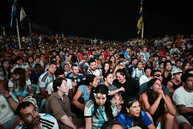 Argentina's fans watch the FIFA World Cup final match between Spain and Argentina at Copacabana beach in Rio de Janeiro, Brazil, on July 19, 2026. (Photo by Pablo PORCIUNCULA / AFP)