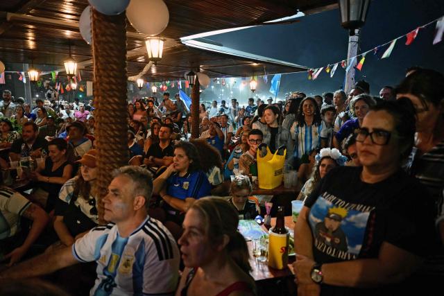 Argentina's fans watch the FIFA World Cup final match between Spain and Argentina at Copacabana beach in Rio de Janeiro, Brazil, on July 19, 2026. (Photo by Pablo PORCIUNCULA / AFP)