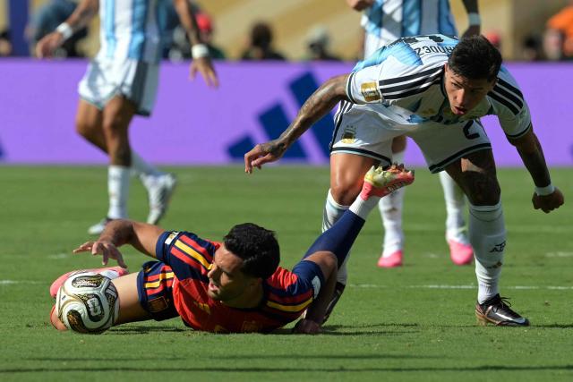 Spain's midfielder #06 Mikel Merino is fouled by Argentina's midfielder #24 Enzo Fernandez during the 2026 World Cup football tournament final match between Spain and Argentina at the New York/New Jersey Stadium in East Rutherford on July 19, 2026.  (Photo by JUAN MABROMATA / AFP)