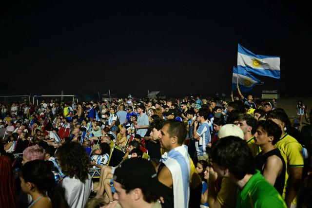 Argentina's fans watch the FIFA World Cup final match between Spain and Argentina at Copacabana beach in Rio de Janeiro, Brazil, on July 19, 2026. (Photo by Pablo PORCIUNCULA / AFP)