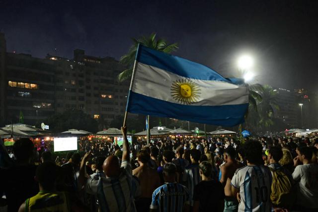 Argentina's fans watch the FIFA World Cup final match between Spain and Argentina at Copacabana beach in Rio de Janeiro, Brazil, on July 19, 2026. (Photo by Pablo PORCIUNCULA / AFP)