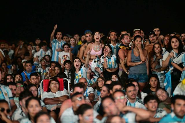 Argentina's fans react as they watch the FIFA World Cup final match between Spain and Argentina at Copacabana beach in Rio de Janeiro, Brazil, on July 19, 2026. (Photo by Pablo PORCIUNCULA / AFP)