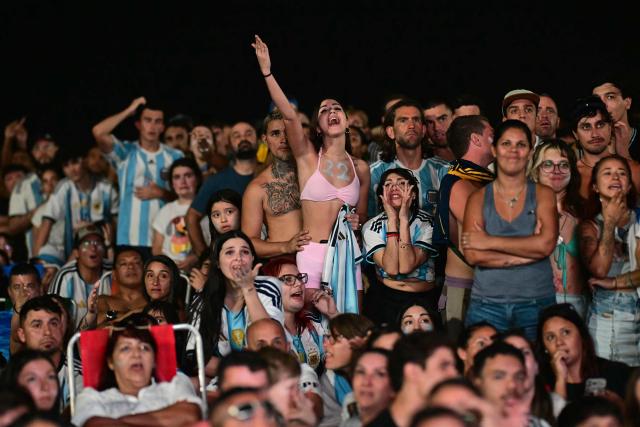 Argentina's fans react as they watch the FIFA World Cup final match between Spain and Argentina at Copacabana beach in Rio de Janeiro, Brazil, on July 19, 2026. (Photo by Pablo PORCIUNCULA / AFP)