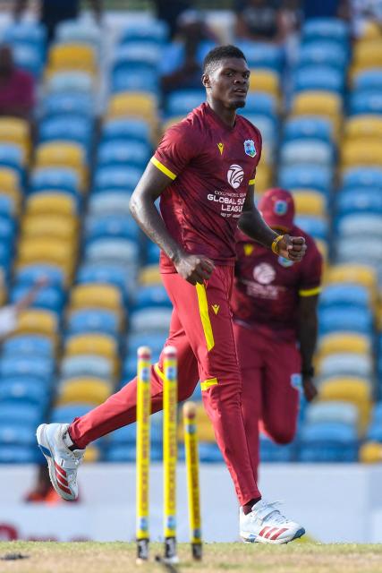Alzarri Joseph of West Indies celebrates the dismissal of Nathan Smith of New Zealand during the 4th One-Day International (ODI) cricket match between West Indies and New Zealand at Kensington Oval in Bridgetown, Barbados on July 19, 2026. (Photo by Randy Brooks / AFP)