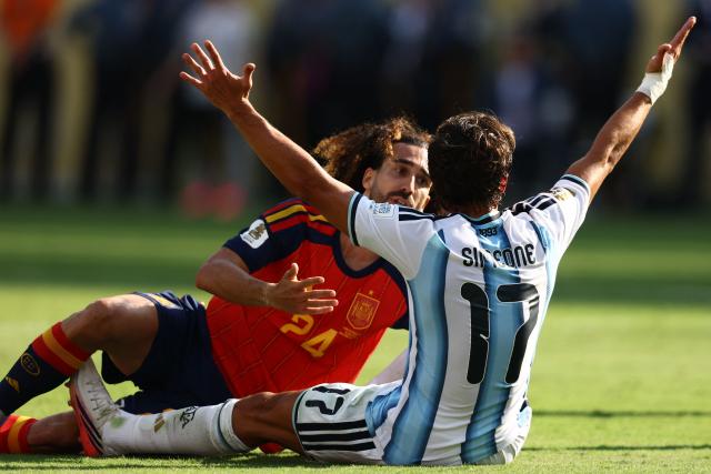 Argentina's forward #17 Giuliano Simeone (R) reacts in front of Spain's defender #24 Marc Cucurella during the 2026 World Cup football tournament final match between Spain and Argentina at the New York/New Jersey Stadium in East Rutherford on July 19, 2026.  (Photo by CHARLY TRIBALLEAU / AFP)