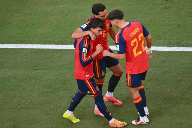 Spain's forward #07 Ferran Torres (L) celebrates with Spain's midfielder #06 Mikel Merino (C) and Spain's defender #22 Pau Cubarsi after he scored Spain's 1-0 goal during the 2026 World Cup football tournament final match between Spain and Argentina at the New York/New Jersey Stadium in East Rutherford on July 19, 2026.  (Photo by ANGELA WEISS / AFP)
