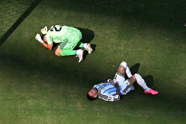 Argentina's goalkeeper #23 Emiliano Martinez and Argentina's defender #19 Nicolas Otamendi react after Spain first goal during the 2026 World Cup football tournament final match between Spain and Argentina at the New York/New Jersey Stadium in East Rutherford on July 19, 2026.  (Photo by MAURO PIMENTEL / AFP)