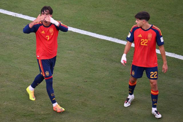 Spain's forward #07 Ferran Torres (L) celebrates with Spain's defender #22 Pau Cubarsi after he scored Spain's 1-0 goal during the 2026 World Cup football tournament final match between Spain and Argentina at the New York/New Jersey Stadium in East Rutherford on July 19, 2026.  (Photo by ANGELA WEISS / AFP)