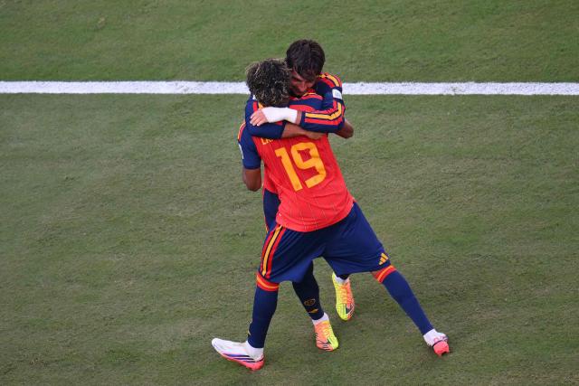 Spain's forward #19 Lamine Yamal (front) celebrates with Spain's forward #07 Ferran Torres after he scored Spain's 1-0 goal during the 2026 World Cup football tournament final match between Spain and Argentina at the New York/New Jersey Stadium in East Rutherford on July 19, 2026.  (Photo by ANGELA WEISS / AFP)