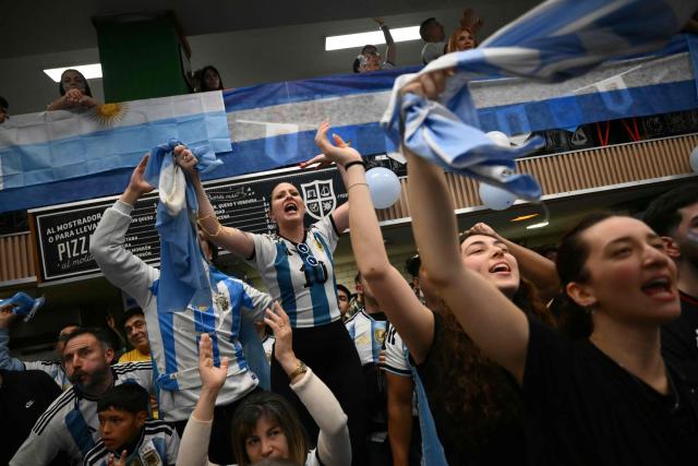 Argentina's fans cheer as they watch the FIFA World Cup final match between Spain and Argentina at a bar in Buenos Aires, on July 19, 2026. (Photo by Luis ROBAYO / AFP)