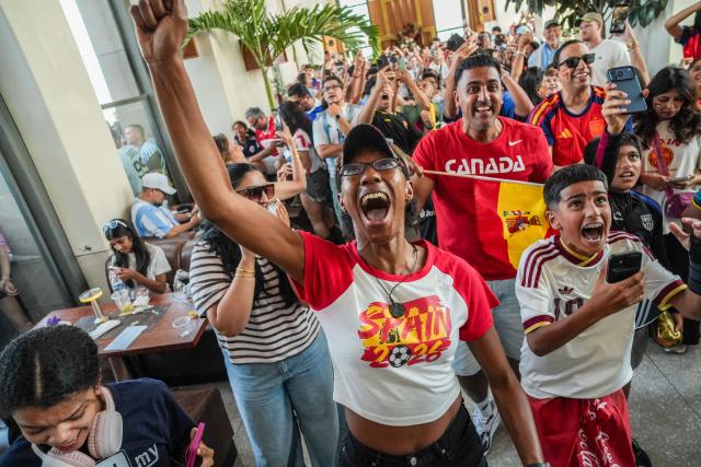 Spain fans cheer after their team won as they watch the 2026 World Cup Final between Spain and Argentina at Rockefeller Center in New York on July 19, 2026. (Photo by Ryan MURPHY / AFP)