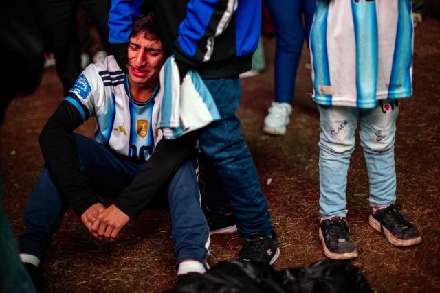An Argentina fan reacts after losing the FIFA World Cup final football match against Spain while watching it on a giant screen in Buenos Aires on July 19, 2026. (Photo by TOMAS CUESTA / AFP)