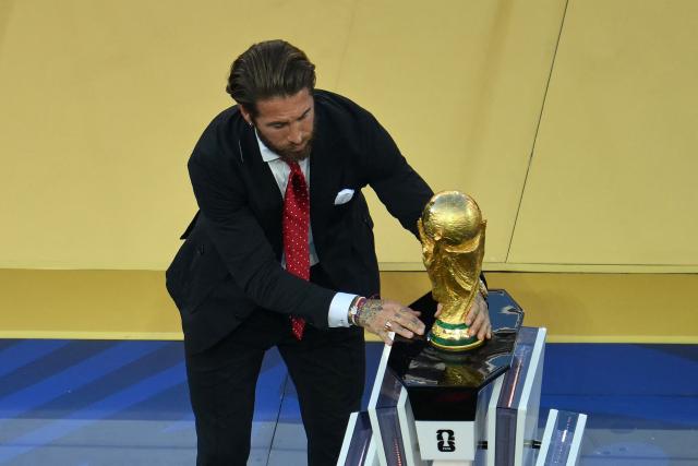 Spanish footballer Sergio Ramos displays the FIFA World Cup Trophy for the ceremony after the 2026 World Cup football tournament final match between Spain and Argentina at the New York/New Jersey Stadium in East Rutherford on July 19, 2026.  (Photo by ANGELA WEISS / AFP)