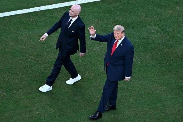 US President Donald Trump (R) and FIFA President Gianni Infantino (L) walk on the pitch ahead of the trophy ceremony after Spain won the 2026 World Cup football tournament final match between Spain and Argentina at the New York/New Jersey Stadium in East Rutherford on July 19, 2026.  (Photo by Jewel SAMAD / AFP)