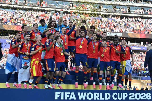 Spain's players celebrates with the trophy after beating Argentina in the 2026 World Cup football tournament final match between Spain and Argentina at the New York/New Jersey Stadium in East Rutherford on July 19, 2026.  (Photo by Mandel NGAN / AFP)