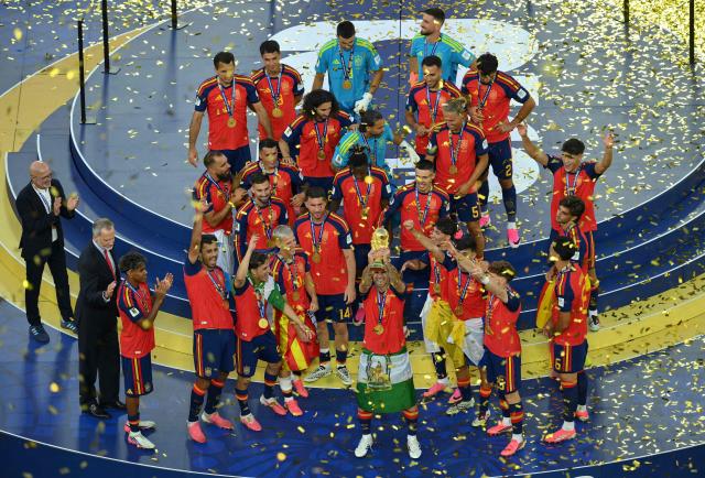 Spain's players celebrate with the FIFA World Cup Trophy during the final ceremony after the 2026 World Cup football tournament final match between Spain and Argentina at the New York/New Jersey Stadium in East Rutherford on July 19, 2026.  (Photo by ANGELA WEISS / AFP)