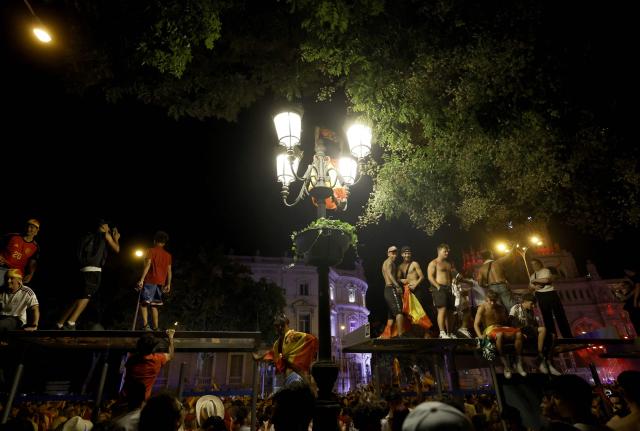 Spain's supporters celebrate victory after the 2026 World Cup final match between Spain and Argentina at Cibeles square in Madrid, on July 19, 2026. (Photo by Oscar DEL POZO / AFP)