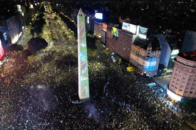 This aerial view shows Argentina's fans gathering at the Obelisk after Argentina lost the FIFA World Cup final football match against Spain in Buenos Aires on July 19, 2026. Spain won by 1-0. (Photo by Luis ROBAYO / AFP)