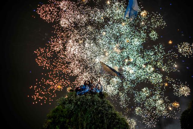 Fireworks are seen near the Obelisk as Argentina's fans gather after Argentina lost the FIFA World Cup final football match against Spain in Buenos Aires on July 19, 2026. Spain won by 1-0. (Photo by TOMAS CUESTA / AFP)
