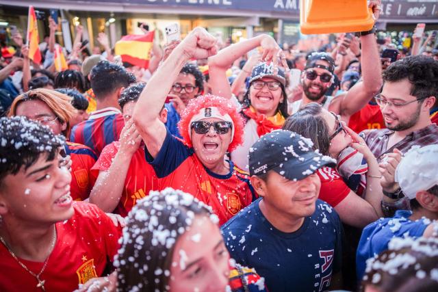 Spain fans celebrate in Times Square after Spain won the 2026 World Cup Final against Argentina in New York on July 19, 2026. (Photo by Ryan MURPHY / AFP)