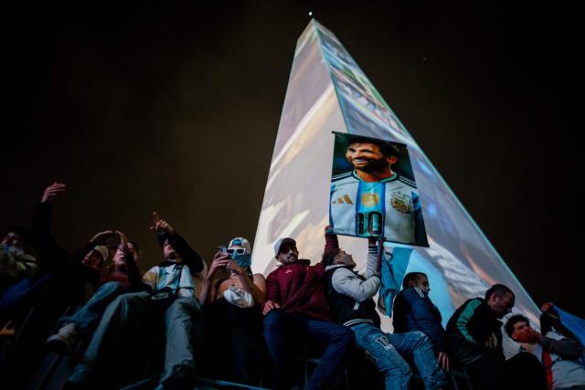 Argentina's fans hold a banner featuring an image of Lionel Messi as they gather at the Obelisk after Argentina lost the FIFA World Cup final football match against Spain in Buenos Aires on July 19, 2026. Spain won by 1-0. (Photo by TOMAS CUESTA / AFP)
