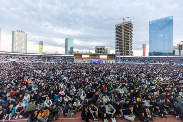 Football fans watch a live broadcast of the 2026 World Cup football final match between Spain and Argentina at a watch party in a stadium in Ulaanbaatar, the capital of Mongolia, early on July 20, 2026. (Photo by BYAMBASUREN BYAMBA-OCHIR / AFP)