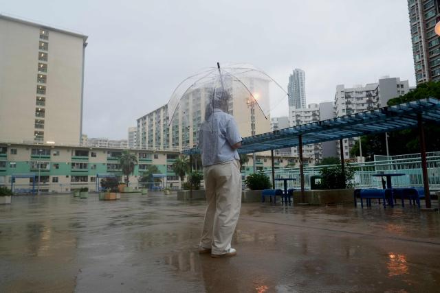 This picture taken in Hong Kong on June 16, 2026 shows Mui, a woman who suffered persistent child sexual abuse for several years, posing for a photo after speaking on the condition of anonymity about her childhood experience. Hong Kong has sought to overhaul its decades-old sexual offence laws, opening sweeping reforms to public consultation this month. The long-awaited reforms will introduce stricter penalties for sexual crimes, but survivors say the changes still do not bar the defence of "mistaken belief". (Photo by Catherine LAI / AFP) / To go with AFP story Hong Kong-China-crime-law-women-children, FOCUS by Tommy WANG