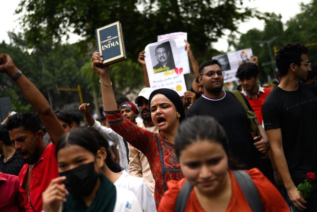 Activists and supporters of the Cockroach Janta Party (CJP) take part in a protest demanding the resignation of India's Education Minister Dharmendra Pradhan over alleged NEET examination irregularities in New Delhi on July 20, 2026. (Photo by Manan VATSYAYANA / AFP)