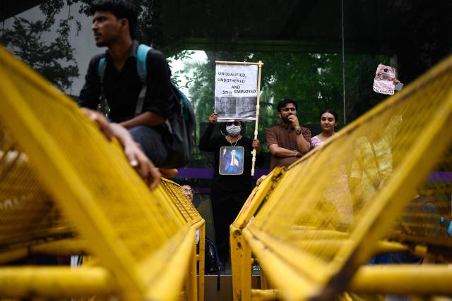 Activists and supporters of the Cockroach Janta Party (CJP) take part in a protest demanding the resignation of India's Education Minister Dharmendra Pradhan over alleged NEET examination irregularities in New Delhi on July 20, 2026. (Photo by Manan VATSYAYANA / AFP)