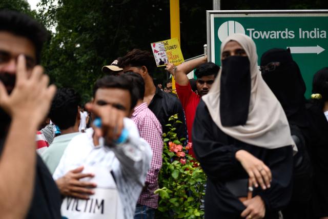 Activists and supporters of the Cockroach Janta Party (CJP) take part in a protest demanding the resignation of India's Education Minister Dharmendra Pradhan over alleged NEET examination irregularities in New Delhi on July 20, 2026. (Photo by Manan VATSYAYANA / AFP)