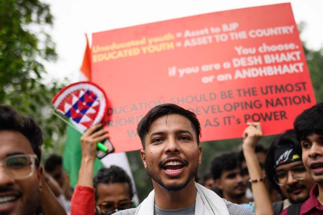 Activists and supporters of the Cockroach Janta Party (CJP) take part in a protest demanding the resignation of India's Education Minister Dharmendra Pradhan over alleged NEET examination irregularities in New Delhi on July 20, 2026. (Photo by Manan VATSYAYANA / AFP)