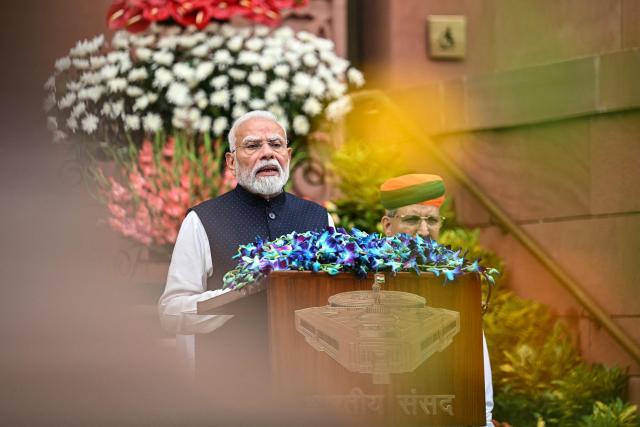 India's Prime Minister Narendra Modi (L) addresses the media on the first day of the monsoon session of the parliament in New Delhi on July 20, 2026. (Photo by Sajjad HUSSAIN / AFP)