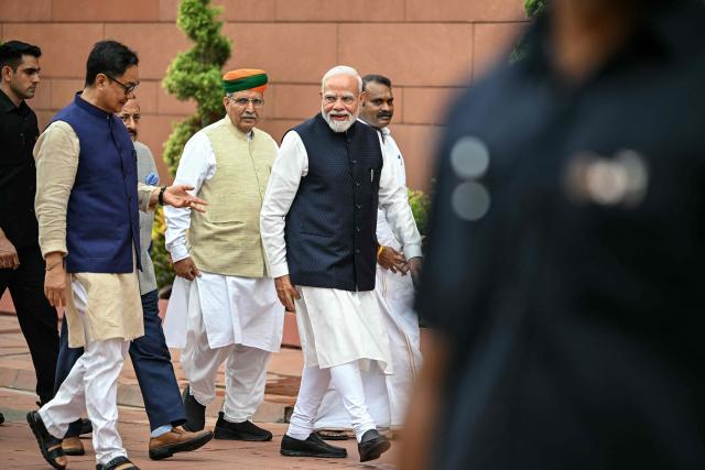 India's Prime Minister Narendra Modi (2R) along with fellow lawmakers arrives to address the media on the first day of the monsoon session of the parliament in New Delhi on July 20, 2026. (Photo by Sajjad HUSSAIN / AFP)