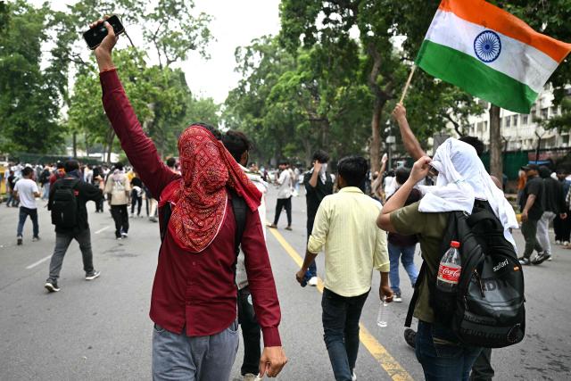 Supporters of the Cockroach Janta Party (CJP) take part in a protest demanding the resignation of India's Education Minister Dharmendra Pradhan over alleged NEET examination irregularities in New Delhi on July 20, 2026. (Photo by Sajjad HUSSAIN / AFP)