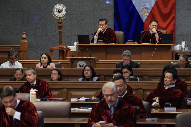 Philippine Senate President Win Gatchalian (top L) and Presiding Officer Francis Escudero (top L) listen during the impeachment trial of Philippine Vice President Sara Duterte at the Senate in Pasay City, Metro Manila on July 20, 2026. (Photo by ELOISA LOPEZ / POOL / AFP)