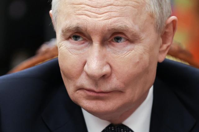 In this pool photograph distributed by the Russian state agency Sputnik, Russia's President Vladimir Putin meets with Moscow-installed leader of the Russian-controlled parts of the Zaporizhzhia region, at the Kremlin in Moscow on July 20, 2026. (Photo by Alexander KAZAKOV / POOL / AFP)