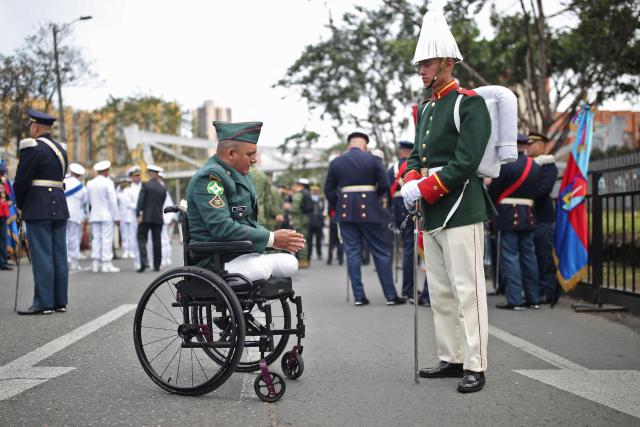 A military member in a wheelchair waits to take part in a military parade commemorating Colombia's Independence Day in Bogota, on July 20, 2026. (Photo by ESTEBAN VEGA LA-ROTTA / AFP)