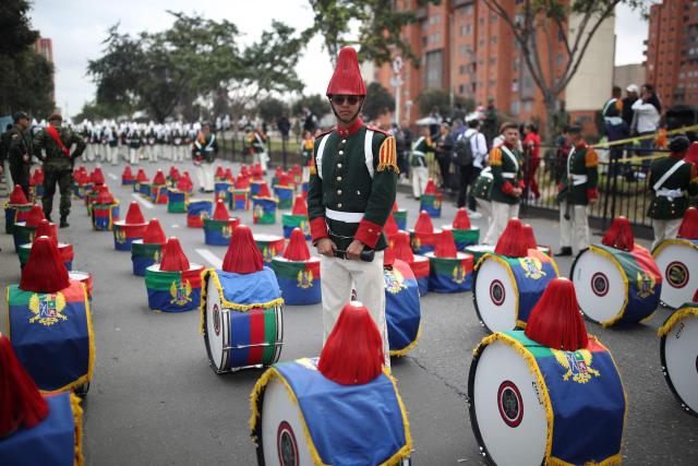 Military members wait to take part in a military parade commemorating Colombia's Independence Day in Bogota, on July 20, 2026. (Photo by ESTEBAN VEGA LA-ROTTA / AFP)
